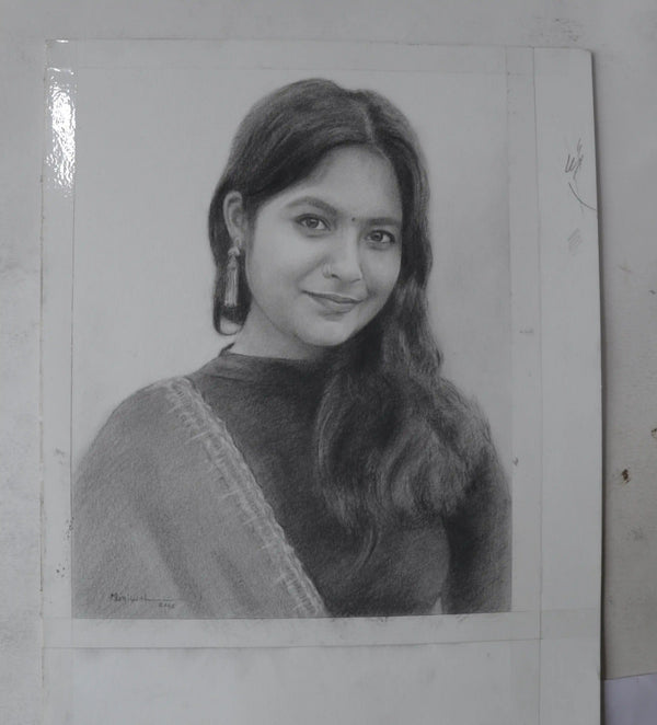 A black and white pencil sketch portrait of a woman with long hair and earrings, shown on a white paper sheet against a light gray background.